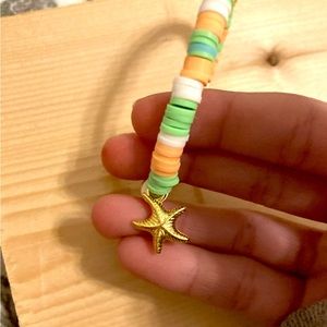 Green white orange beaded bracelet